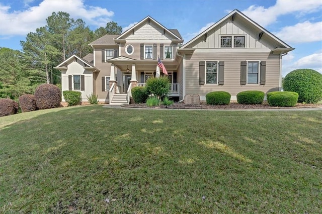 87 Washington Blvd, Dallas, GA 30132 - craftsman-style house with covered porch, board and batten siding, and a front yard