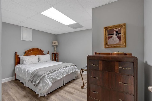 87 Washington Blvd, Dallas, GA 30132 - bedroom with light wood-style flooring, baseboards, and a drop ceiling