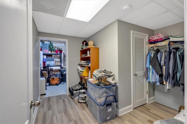 87 Washington Blvd, Dallas, GA 30132 - interior space featuring light wood-style flooring, a paneled ceiling, and baseboards