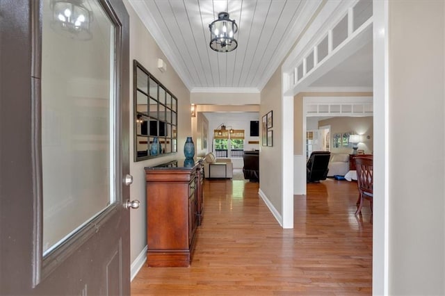 87 Washington Blvd, Dallas, GA 30132 - entryway featuring light wood finished floors, crown molding, and a chandelier