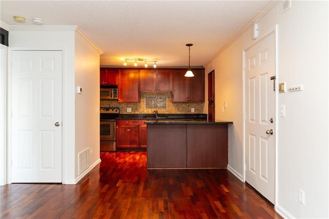 kitchen featuring backsplash, stainless steel appliances, hanging light fixtures, and ornamental molding