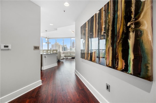 1080 Peachtree St NE Unit 2710, Atlanta, GA 30309 - hall with dark wood-style flooring, recessed lighting, and a city view