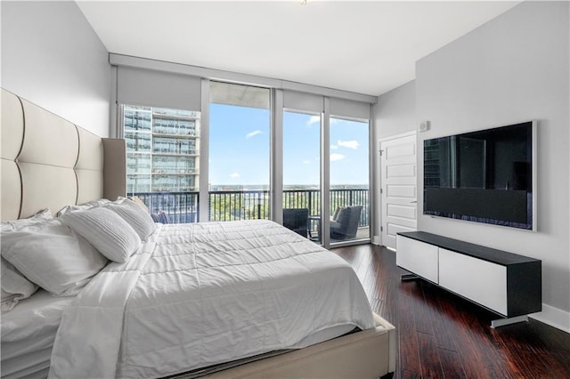 1080 Peachtree St NE Unit 2710, Atlanta, GA 30309 - bedroom with access to exterior and dark wood-style flooring