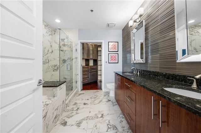 1080 Peachtree St NE Unit 2710, Atlanta, GA 30309 - full bath with marble look tile flooring, a marble finish shower, and double vanity