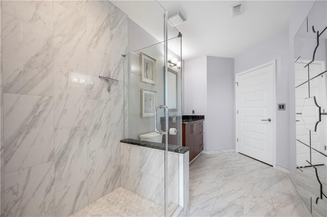 1080 Peachtree St NE Unit 2710, Atlanta, GA 30309 - bathroom featuring a marble finish shower, vanity, and marble look tiles