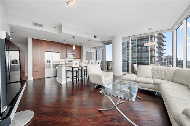 1080 Peachtree St NE Unit 2710, Atlanta, GA 30309 - living room with plenty of natural light and dark wood-style flooring