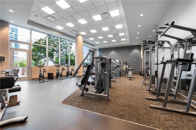 1080 Peachtree St NE Unit 2710, Atlanta, GA 30309 - exercise room featuring a high ceiling, a drop ceiling, and recessed lighting