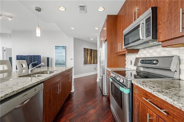 1080 Peachtree St NE Unit 2710, Atlanta, GA 30309 - kitchen with appliances with stainless steel finishes, decorative backsplash, dark wood-type flooring, recessed lighting, and pendant lighting