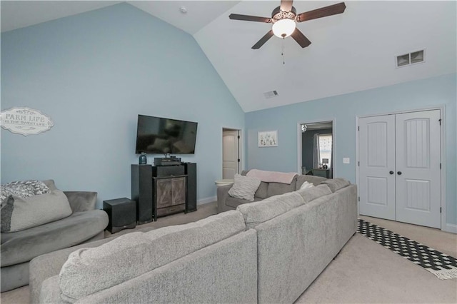 living area with high vaulted ceiling, visible vents, light colored carpet, and a ceiling fan