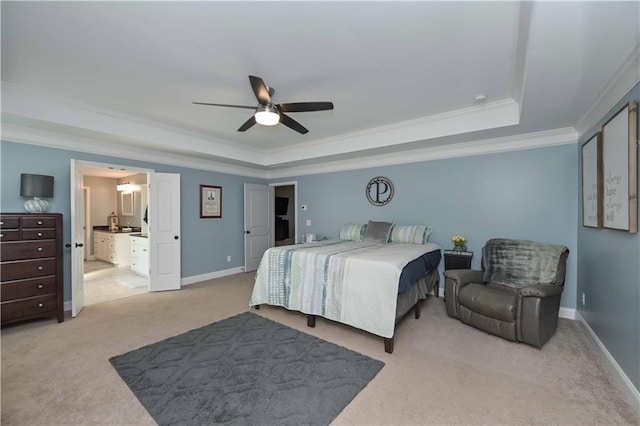 bedroom with crown molding, baseboards, light carpet, a raised ceiling, and a ceiling fan