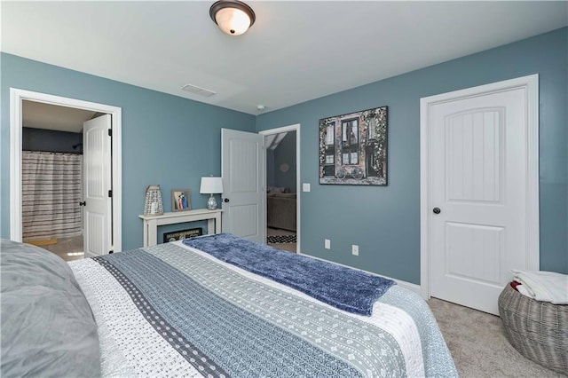 bedroom featuring carpet flooring, baseboards, and visible vents