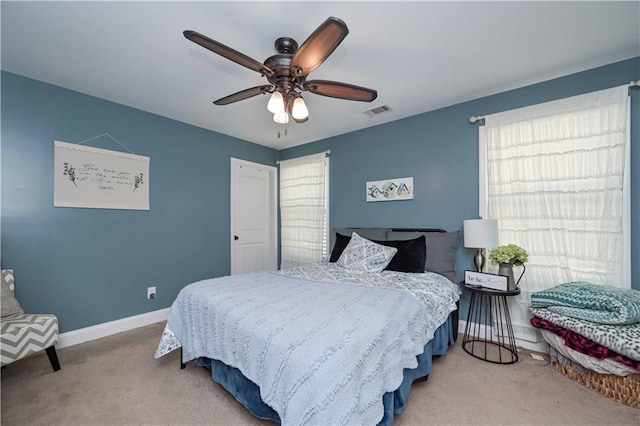 bedroom featuring carpet, baseboards, visible vents, and a ceiling fan