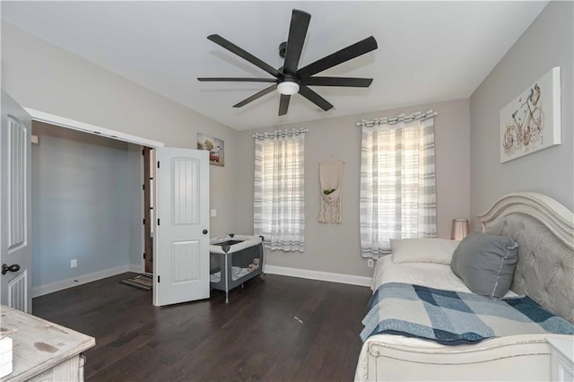 bedroom featuring a ceiling fan, wood finished floors, and baseboards