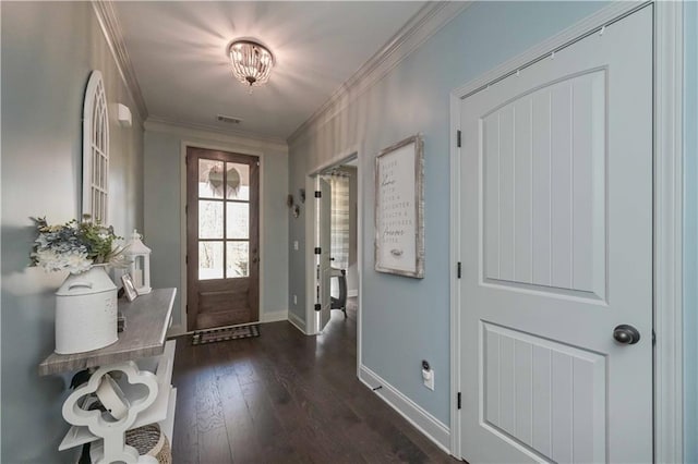 foyer with dark wood finished floors, baseboards, visible vents, and ornamental molding
