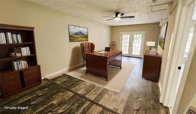 office with dark wood-style flooring, a textured ceiling, french doors, a ceiling fan, and baseboards
