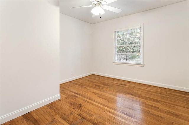 spare room featuring ceiling fan and wood-type flooring