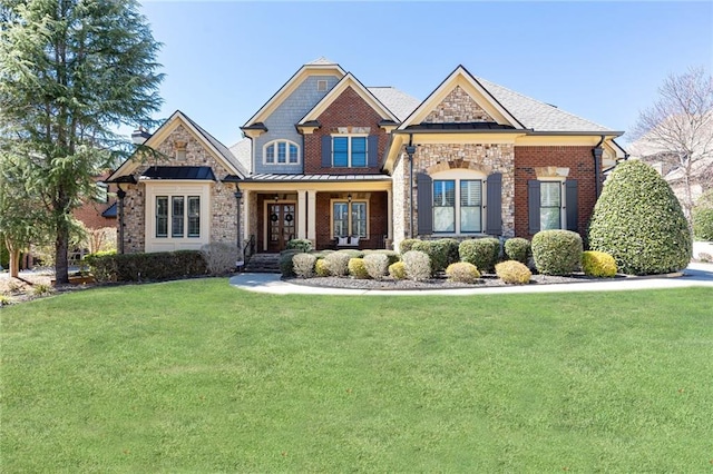 5352 Lacosta Ln, Alpharetta, GA 30022 - craftsman-style home with a front yard, brick siding, a porch, and stone siding
