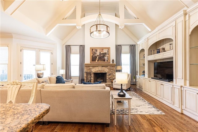 5352 Lacosta Ln, Alpharetta, GA 30022 - living area with healthy amount of natural light, wood finished floors, high vaulted ceiling, a fireplace, and beam ceiling