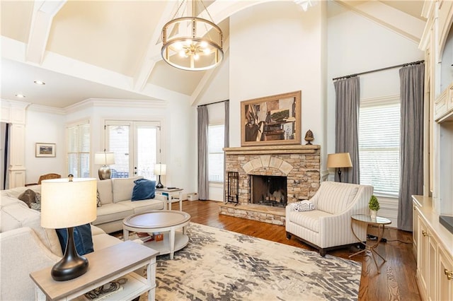 5352 Lacosta Ln, Alpharetta, GA 30022 - living room featuring high vaulted ceiling, a chandelier, dark wood-style floors, a stone fireplace, and beamed ceiling