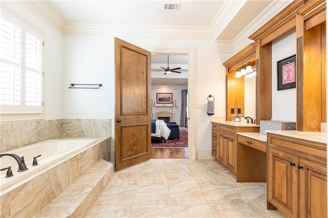 5352 Lacosta Ln, Alpharetta, GA 30022 - ensuite bathroom featuring a fireplace, vanity, crown molding, a garden tub, and a ceiling fan