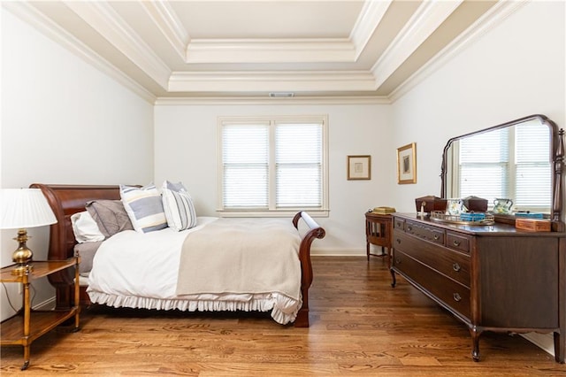 5352 Lacosta Ln, Alpharetta, GA 30022 - bedroom with a tray ceiling, multiple windows, ornamental molding, and wood finished floors