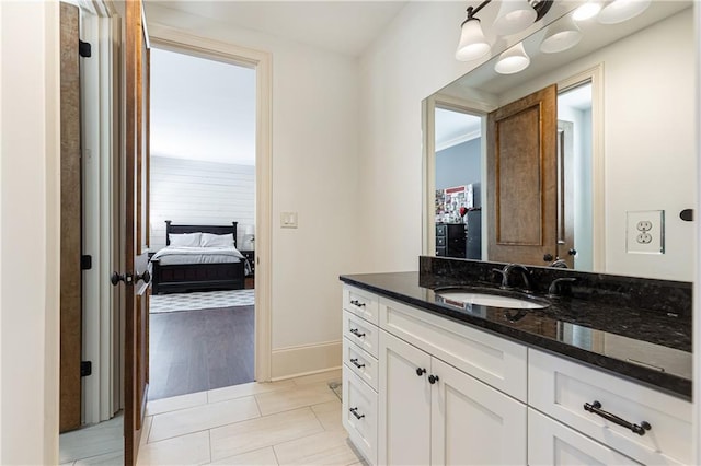 5352 Lacosta Ln, Alpharetta, GA 30022 - ensuite bathroom featuring vanity, baseboards, and tile patterned flooring