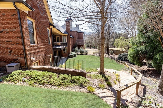 5352 Lacosta Ln, Alpharetta, GA 30022 - view of green lawn with a balcony