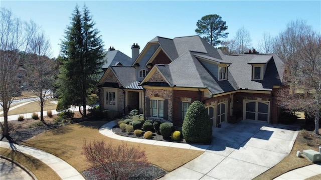 5352 Lacosta Ln, Alpharetta, GA 30022 - view of front of house with concrete driveway, an attached garage, a shingled roof, and a chimney