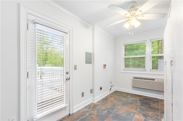 doorway featuring crown molding, ceiling fan, a wall mounted air conditioner, baseboards, and stone finish flooring