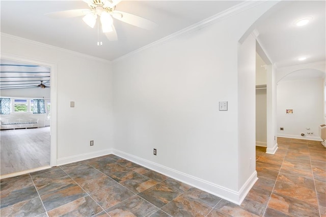 unfurnished room featuring ceiling fan, baseboard heating, arched walkways, stone tile floors, and baseboards
