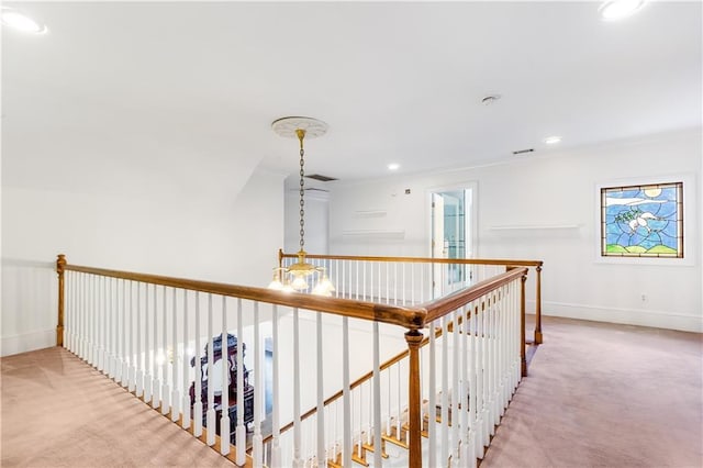 hallway with baseboards, carpet flooring, an upstairs landing, and recessed lighting