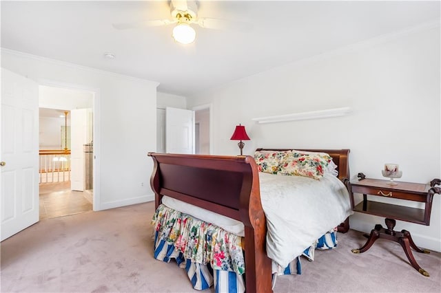 bedroom with baseboards, carpet flooring, a ceiling fan, and ornamental molding