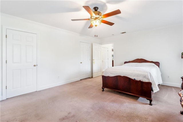 bedroom featuring ornamental molding, carpet flooring, and visible vents