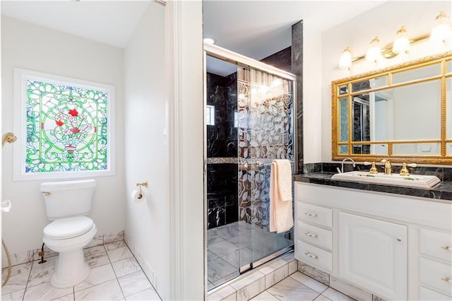 full bathroom with a stall shower, toilet, marble finish floor, and vanity