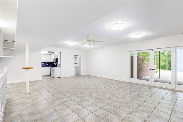 unfurnished living room featuring french doors, a ceiling fan, a textured ceiling, light tile patterned floors, and baseboards