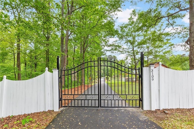 view of gate featuring fence