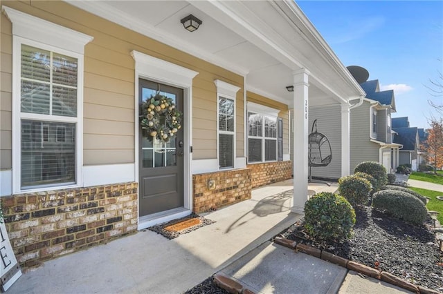 doorway to property featuring covered porch