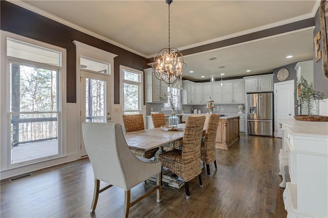 dining space with plenty of natural light, visible vents, and dark wood-style flooring