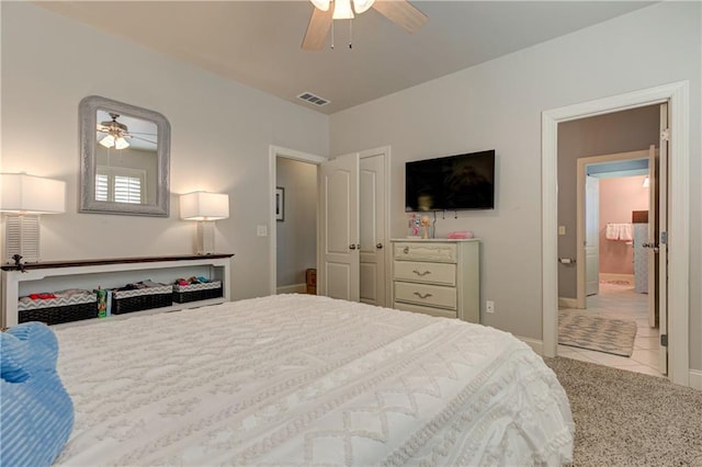 tiled bedroom featuring a ceiling fan, visible vents, and baseboards