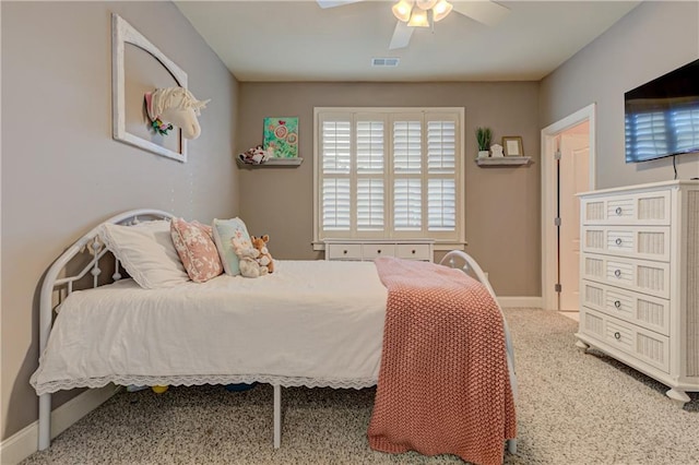 bedroom featuring ceiling fan, carpet flooring, visible vents, and baseboards