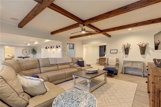 living room with ceiling fan, recessed lighting, baseboards, light wood-style floors, and beamed ceiling