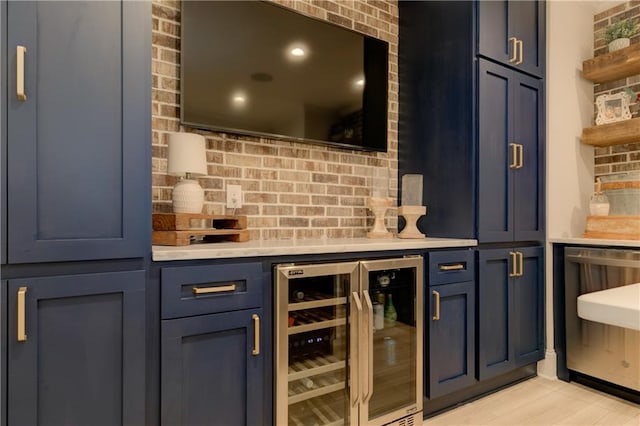 bar featuring beverage cooler, brick wall, and a dry bar