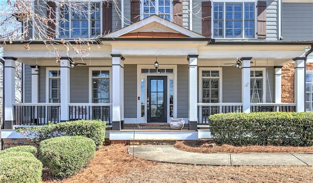 property entrance with a porch and ceiling fan