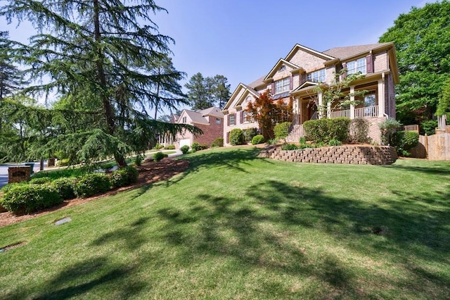 craftsman-style home with a front lawn