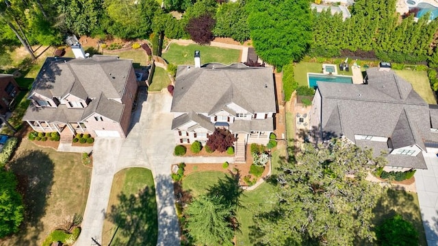 birds eye view of property with a residential view