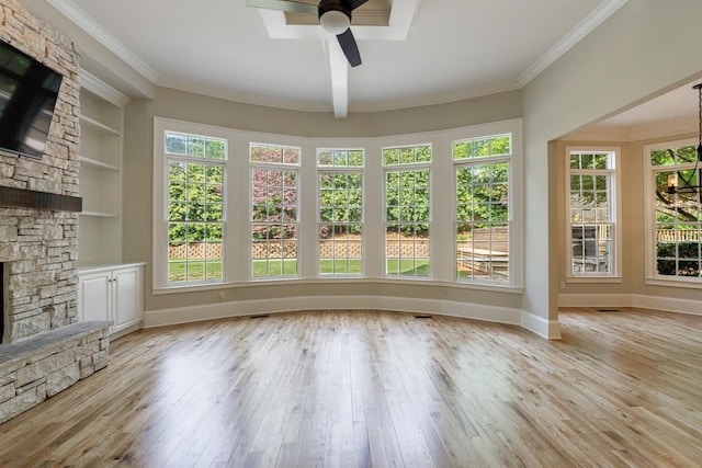 unfurnished sunroom with wood-type flooring, baseboards, ornamental molding, and french doors