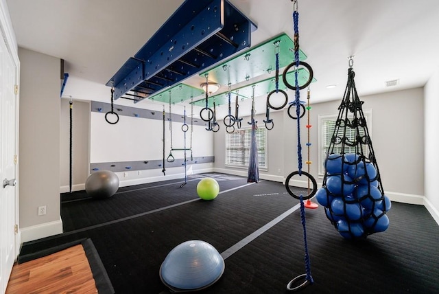 workout area with baseboards and visible vents