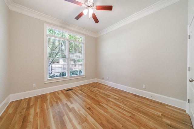 unfurnished room featuring light wood finished floors, baseboards, visible vents, a ceiling fan, and ornamental molding