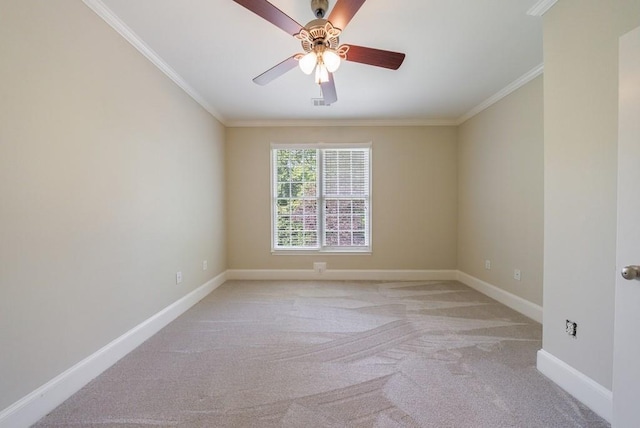 unfurnished room with ceiling fan, light carpet, ornamental molding, and baseboards