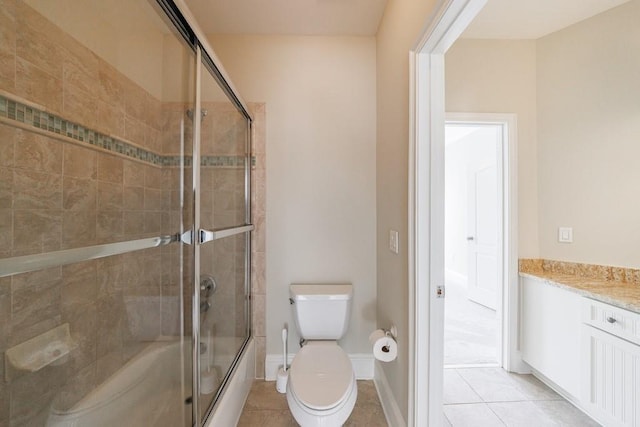 full bath featuring vanity, toilet, a shower with door, and tile patterned flooring